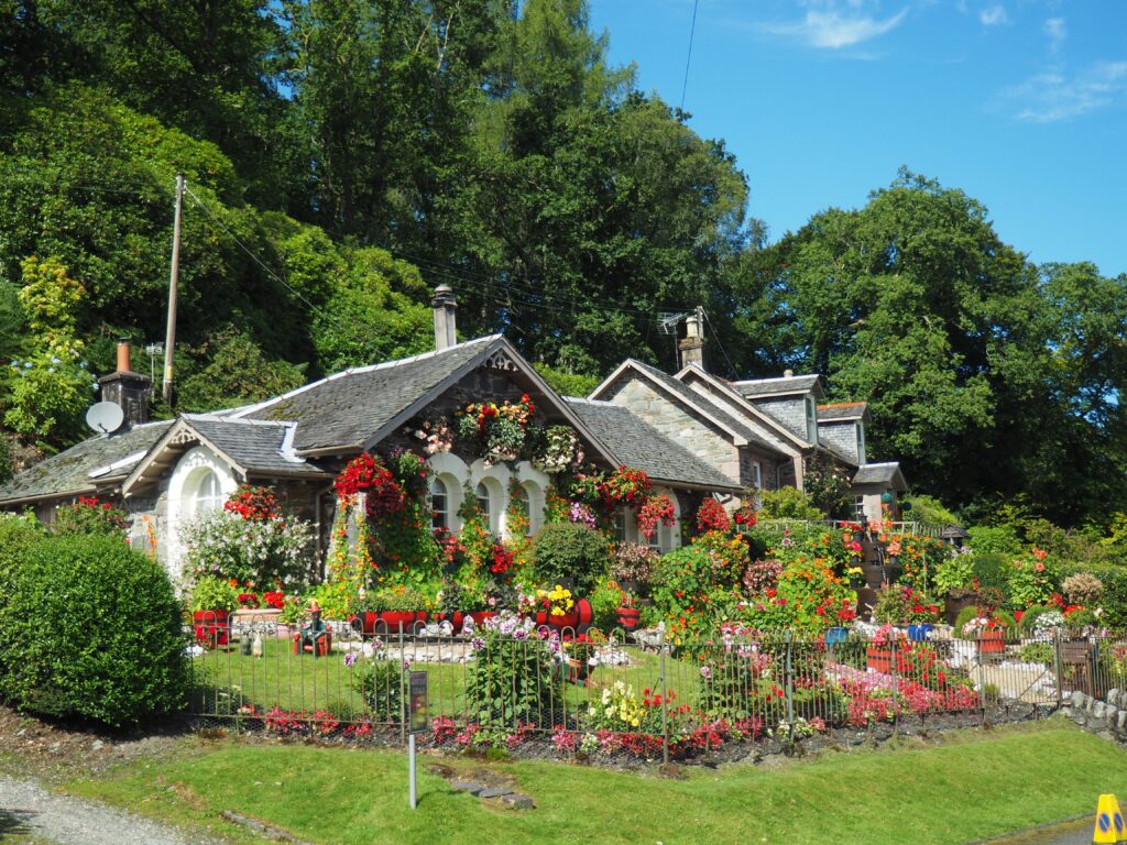 house with a beautiful flower garden
