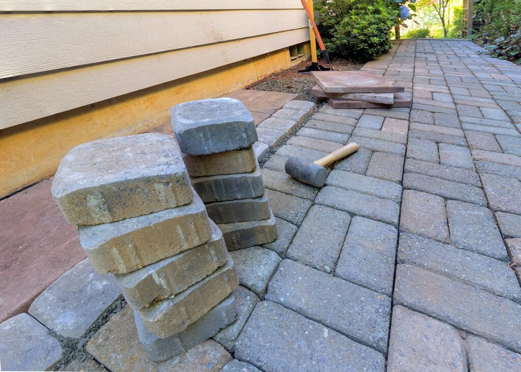 Stone pavers and tools for side yard hardscapes