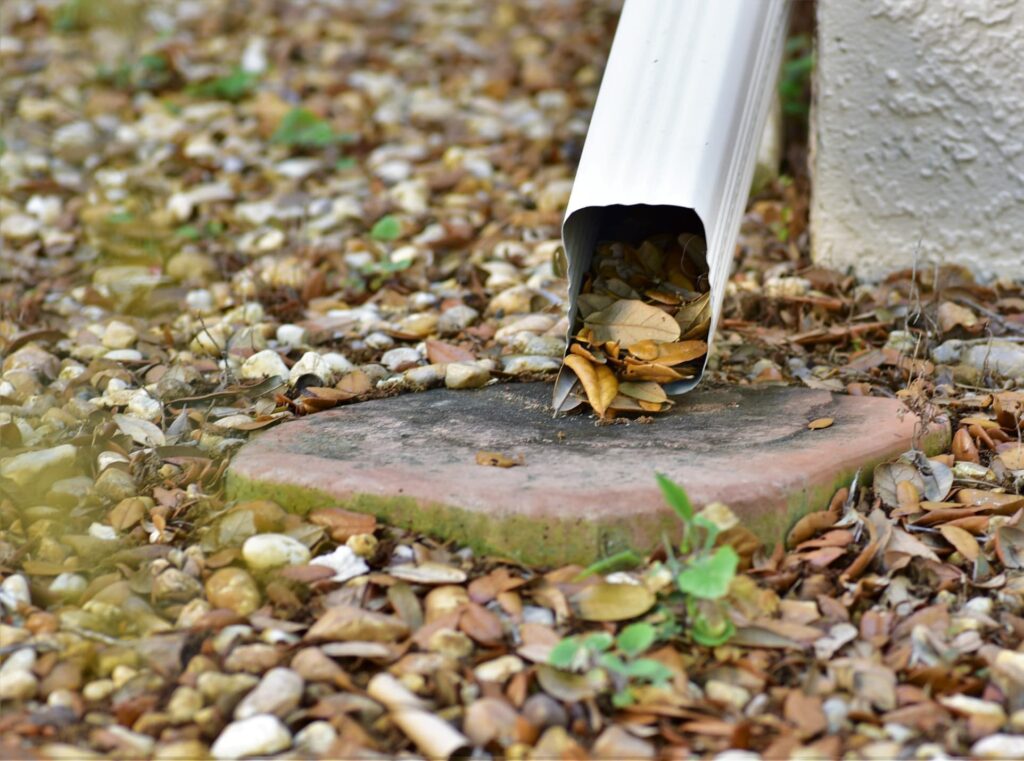 Properly functioning gutters and downspouts can prevent rainwater from overflowing and causing issues around the foundation of a building.