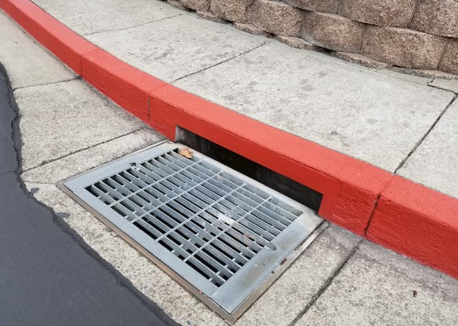 Storm water drains are essential for preventing flooding in streets, parking lots, and walkways.