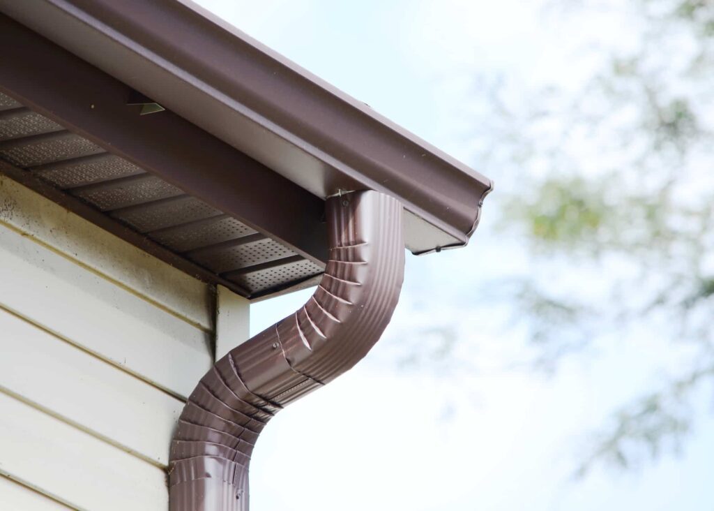 Drainage solution redirecting downspout runoff away from home
