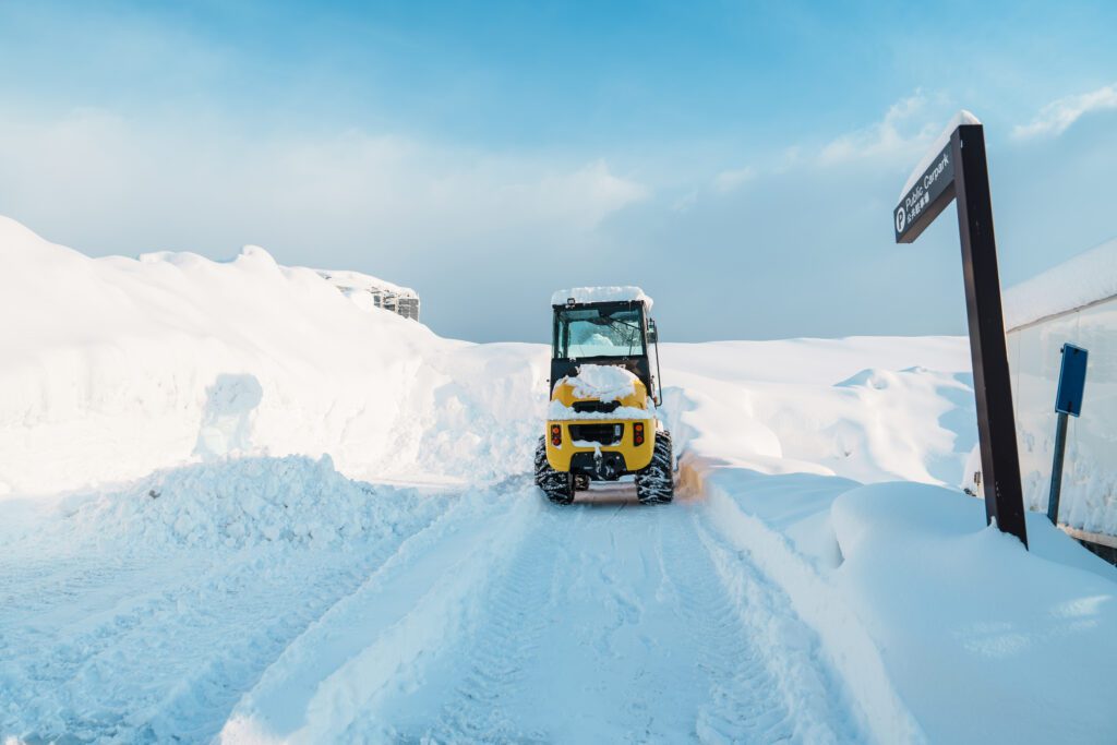 tractor removes snow. Cleaning and clearing.