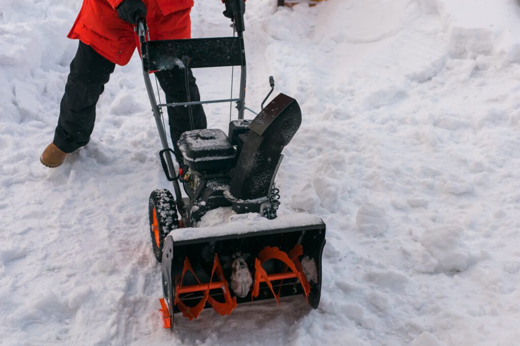 A snow clearing with snow blower. Winter season and snow blower equipment.